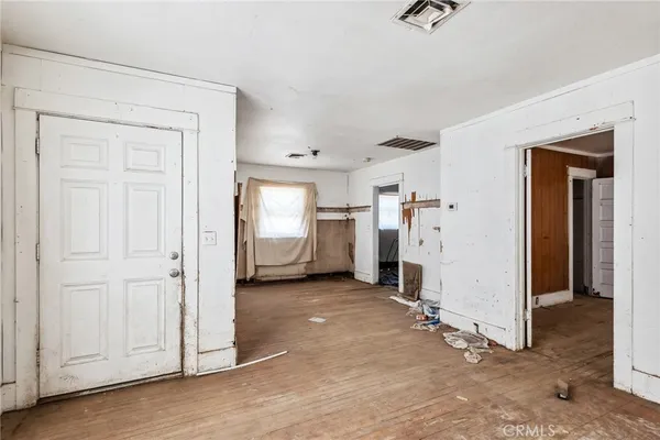 a view of a livingroom with storage & utility room