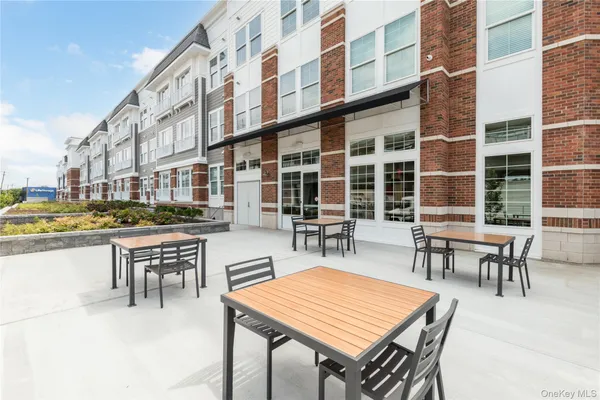 a patio with table and chairs