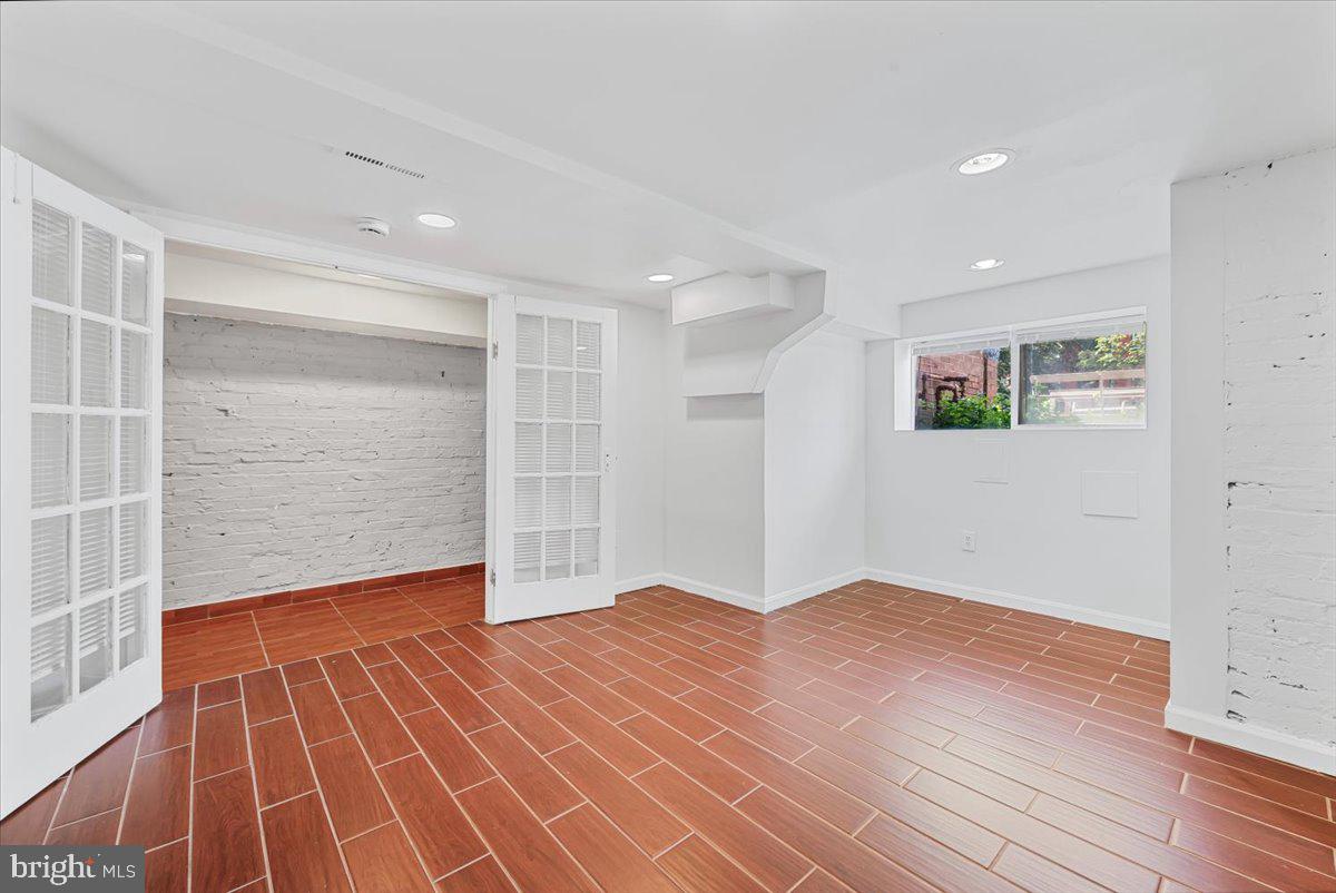 30 R Street Northeast, Unit B Washington, DC 20002 - Photo 6 of 21 a view of an empty room with wooden floor