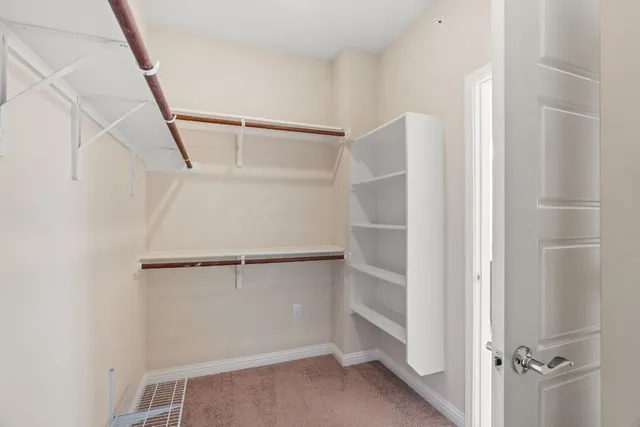 a view of an empty walk in closet