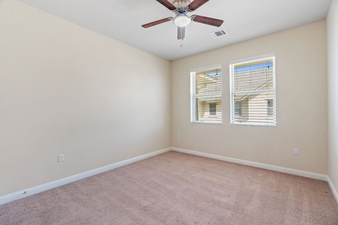6814 East Riverside Drive, Unit 35 Austin, TX 78741 - Photo 20 of 31 an empty room with a window and a fan