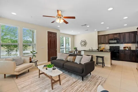 a living room with furniture and a window