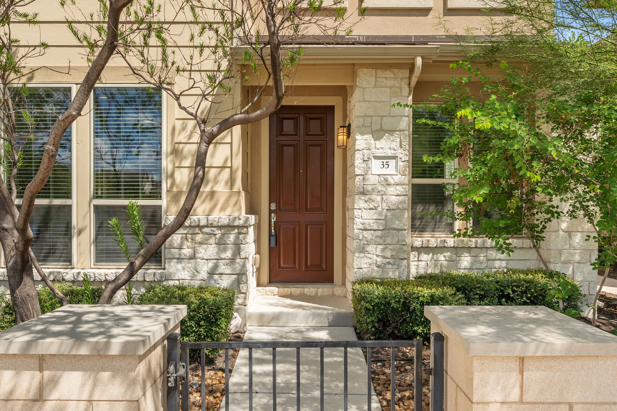 6814 East Riverside Drive, Unit 35 Austin, TX 78741 - Photo 3 of 31 a front view of a house with a yard