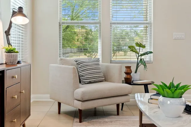 a living room with furniture and a large window