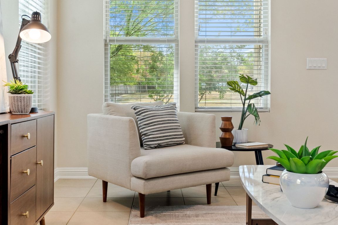 6814 East Riverside Drive, Unit 35 Austin, TX 78741 - Photo 6 of 31 a living room with furniture and a potted plant