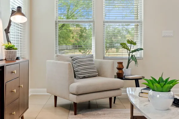 a living room with furniture and a large window