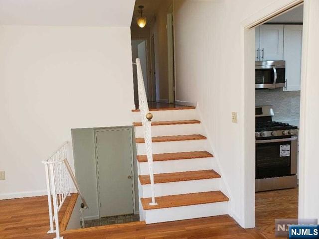 27 Ridge Road Cresskill, NJ 07626 - Photo 12 of 18 a view of a kitchen from the hallway