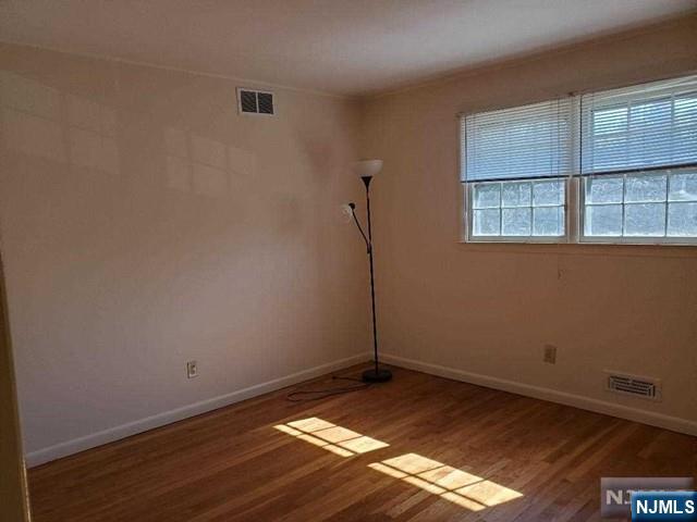27 Ridge Road Cresskill, NJ 07626 - Photo 16 of 18 a view of a room with wooden floor and window