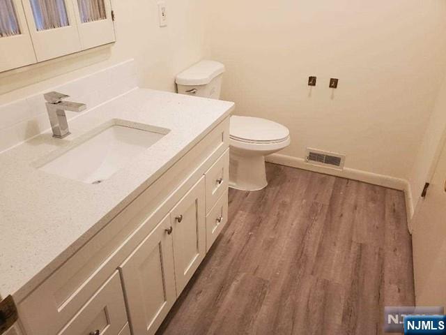 27 Ridge Road Cresskill, NJ 07626 - Photo 18 of 18 a bathroom with a sink a toilet and shower