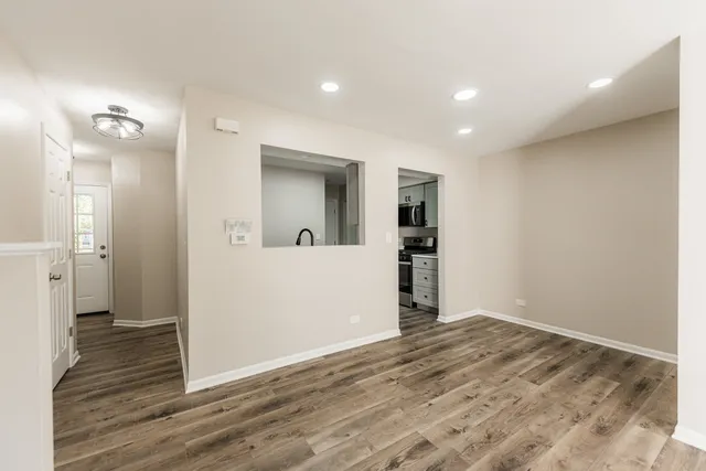 a view of an empty room with a window