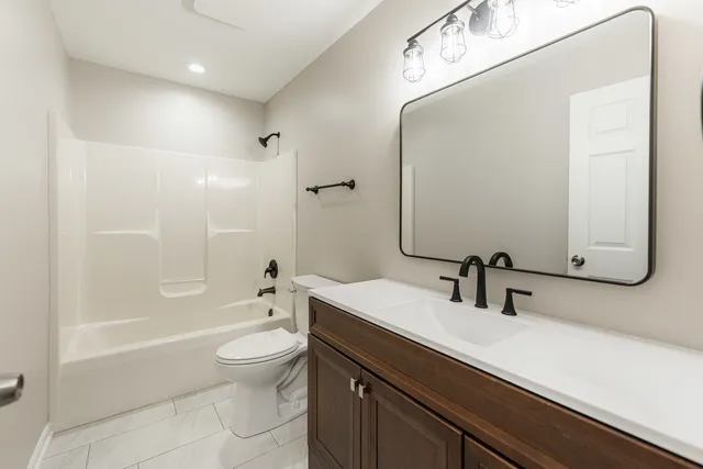 a view of water heater room with stairs