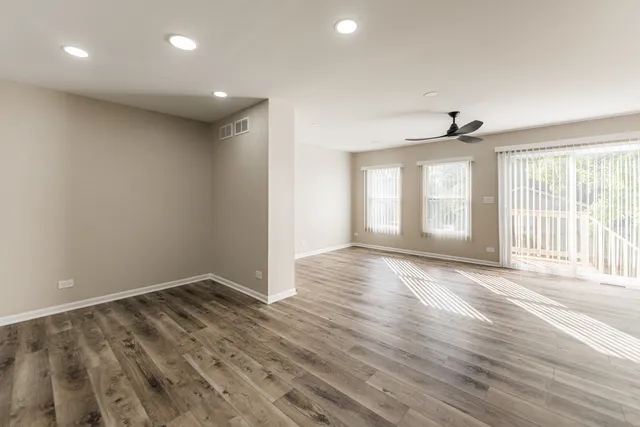 a view of a kitchen cabinets and wooden floor