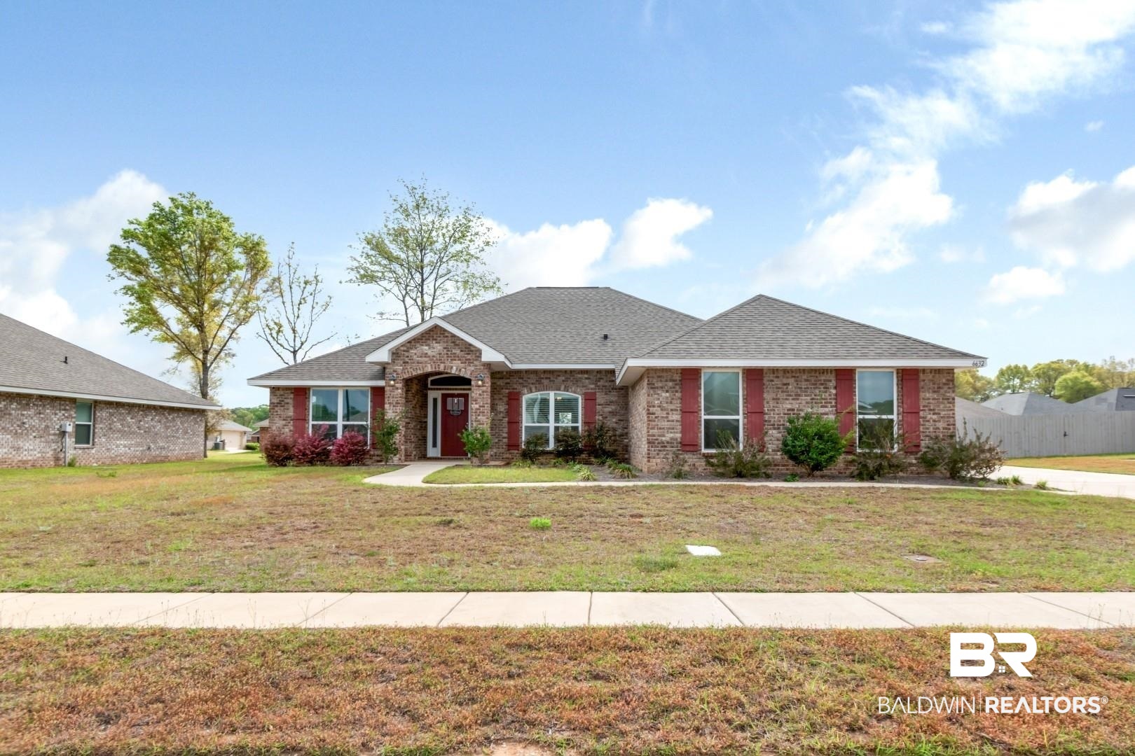 6632 Monarch Circle Mobile, AL 36618 - Photo 2 of 32 Ranch-style house with brick siding and roof with shingles