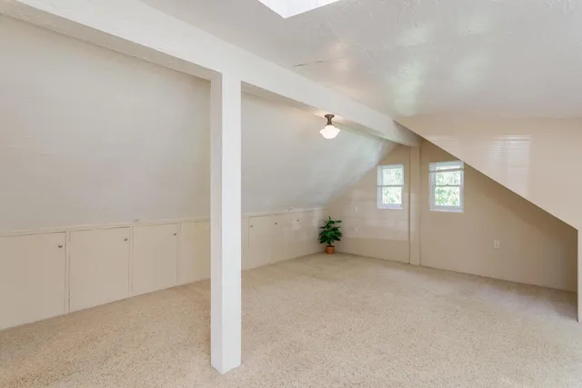 a bathroom with a shower and a glass door