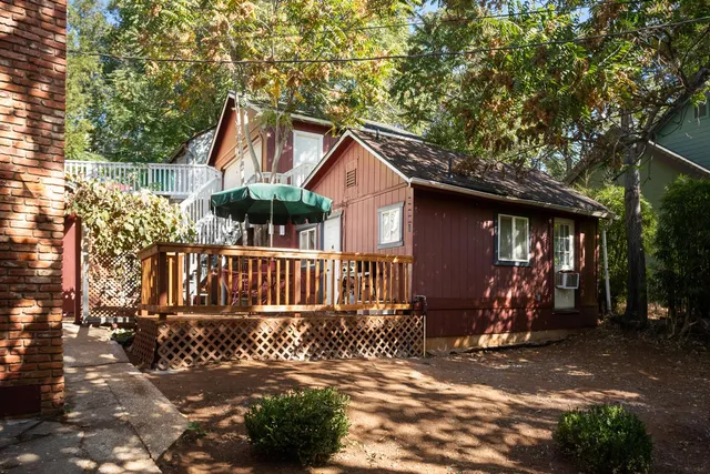 an aerial view of a house with a yard and garden