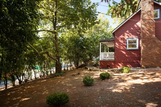 a view of a house with a small yard