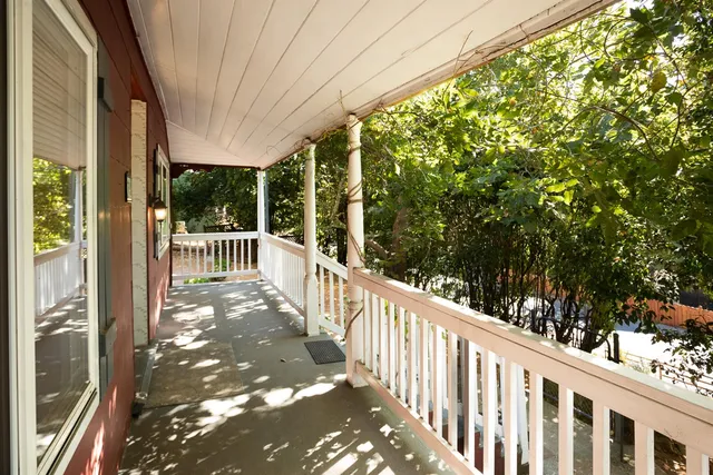 a view of a wooden fence next to a road