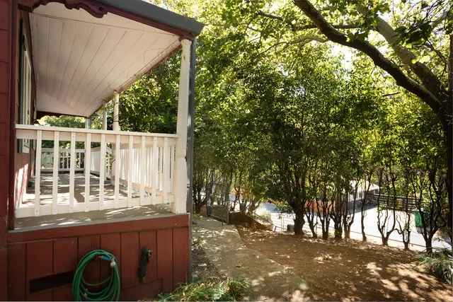 a view of balcony with wooden floor