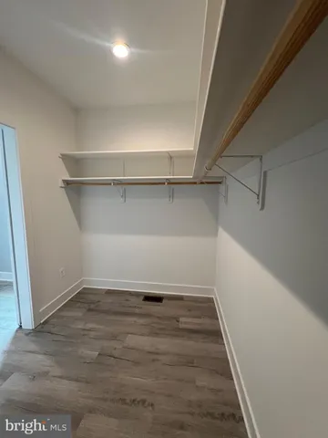 a bathroom with a sink mirror vanity and toilet