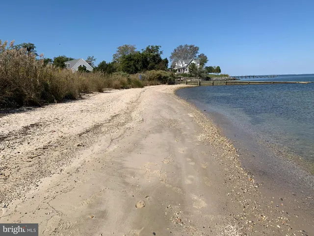 a view of a balcony with wooden floor and outdoor space