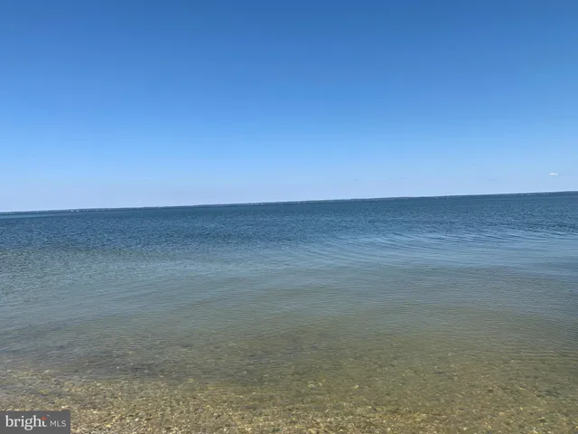 a sign board with a lake view