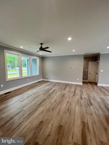 a large kitchen with stainless steel appliances kitchen island a large island in the center