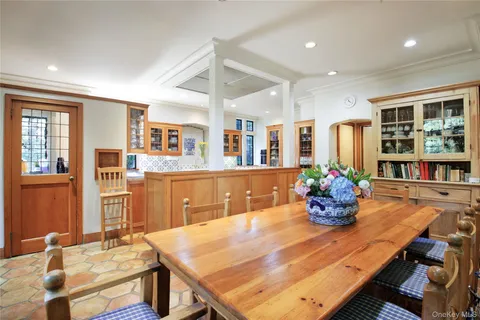 a dining room with furniture and wooden floor