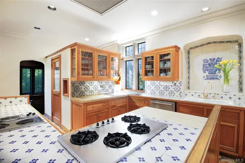 a kitchen with a stove and a sink