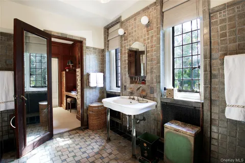 a bathroom with a sink a toilet and tub