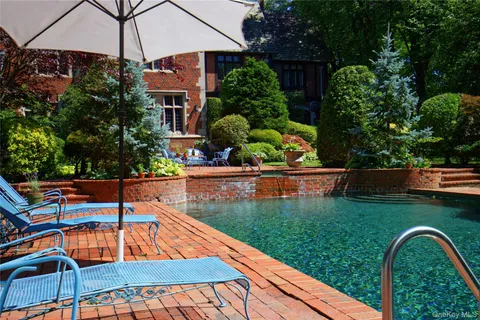 a view of swimming pool with a patio