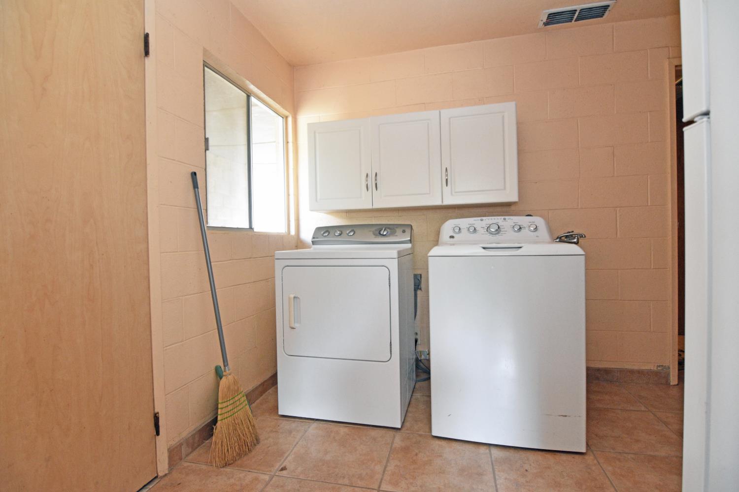 1206 South Verduga Road Turlock, CA 95380 - Photo 25 of 36 a utility room with dryer and washer