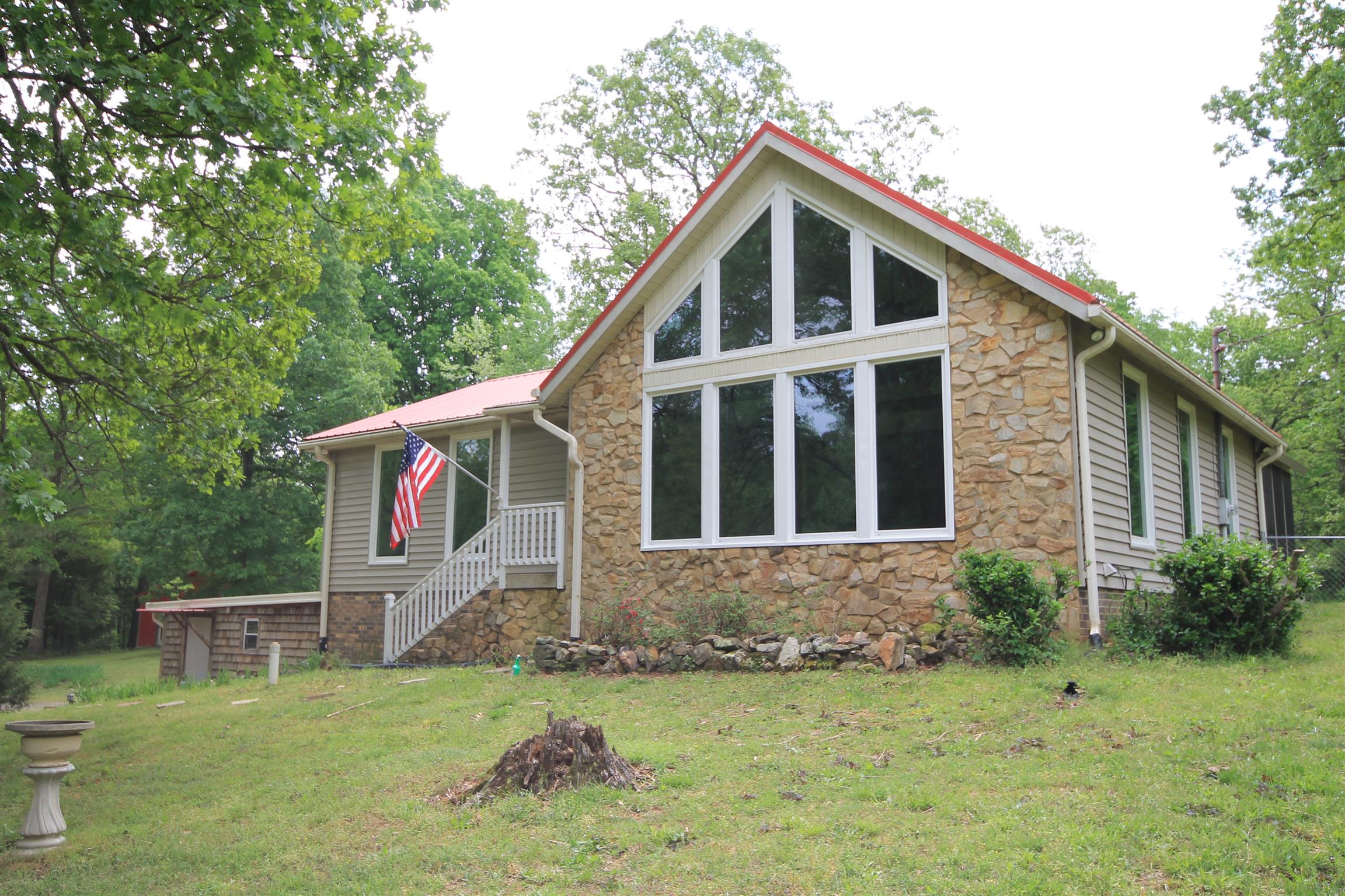 7184 Bahne Road Fairview, TN 37062 - Photo 1 of 14 a front view of a house with a yard