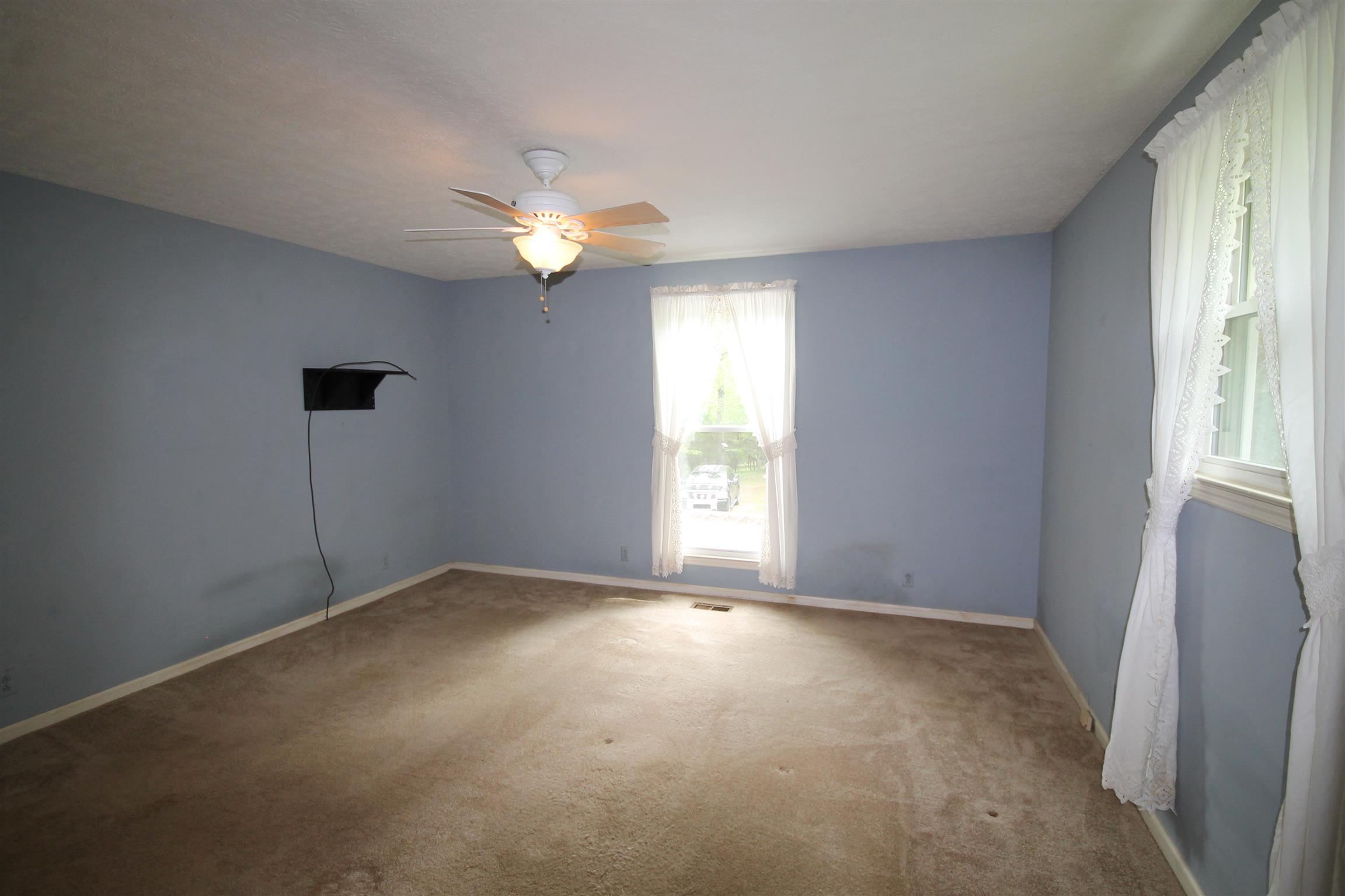 7184 Bahne Road Fairview, TN 37062 - Photo 8 of 14 an empty room with windows and fan