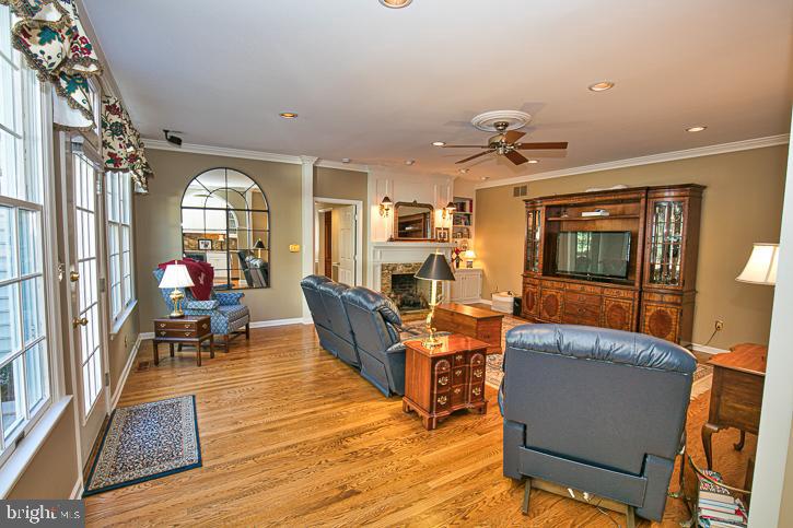 3589 Union Church Road Salisbury, MD 21804 - Photo 17 of 84 a living room with furniture a chandelier and a flat screen tv