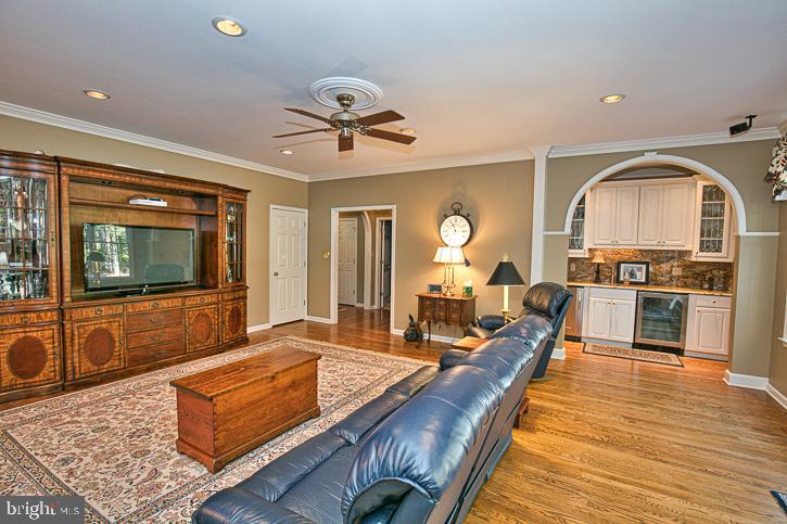 3589 Union Church Road Salisbury, MD 21804 - Photo 18 of 84 a living room with stainless steel appliances furniture a rug and a view of kitchen