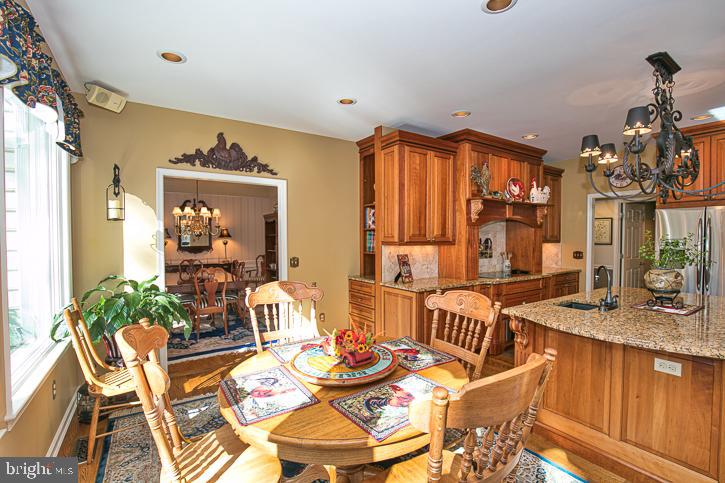 3589 Union Church Road Salisbury, MD 21804 - Photo 27 of 84 a dining room with furniture a chandelier and wooden floor