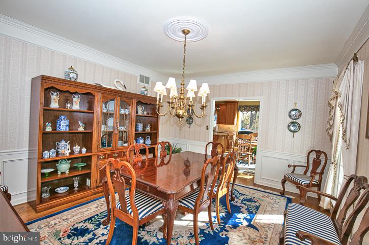 3589 Union Church Road Salisbury, MD 21804 - Photo 28 of 84 a dining room with furniture a chandelier and window
