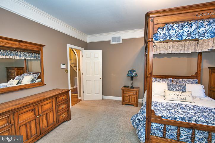 3589 Union Church Road Salisbury, MD 21804 - Photo 34 of 84 a bedroom with furniture and a wooden floor