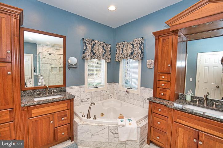 3589 Union Church Road Salisbury, MD 21804 - Photo 37 of 84 a bathroom with a granite countertop sink and a mirror