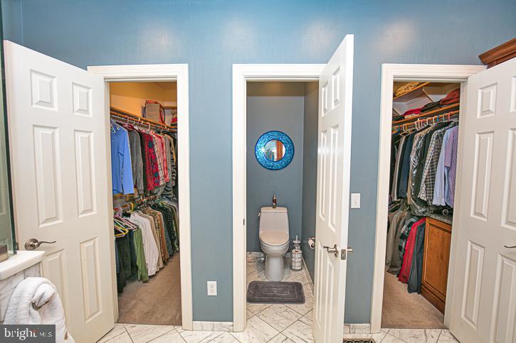 3589 Union Church Road Salisbury, MD 21804 - Photo 38 of 84 a view of walk in closet with clothes and shoes