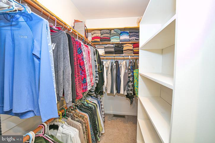 3589 Union Church Road Salisbury, MD 21804 - Photo 40 of 84 a view of walk in closet with clothes and shoes