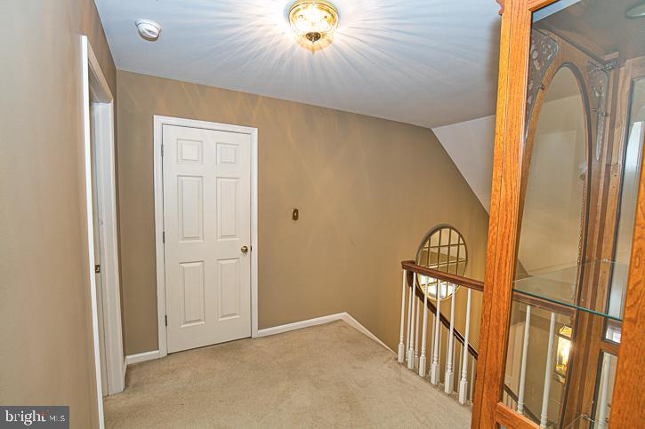 3589 Union Church Road Salisbury, MD 21804 - Photo 42 of 84 a view of a hallway with wooden floor and staircase