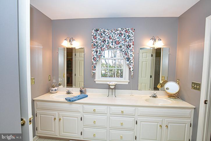 3589 Union Church Road Salisbury, MD 21804 - Photo 46 of 84 a bathroom with a sink vanity and a mirror