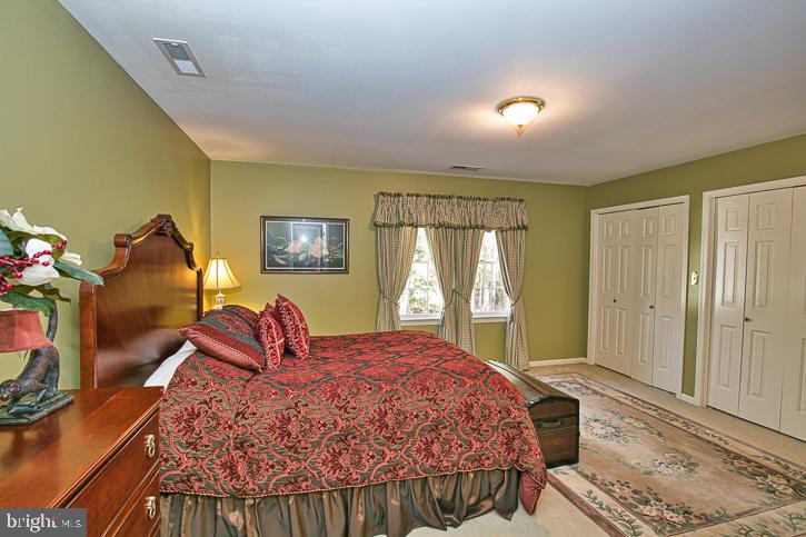 3589 Union Church Road Salisbury, MD 21804 - Photo 48 of 84 a bed sitting in a room next to a window