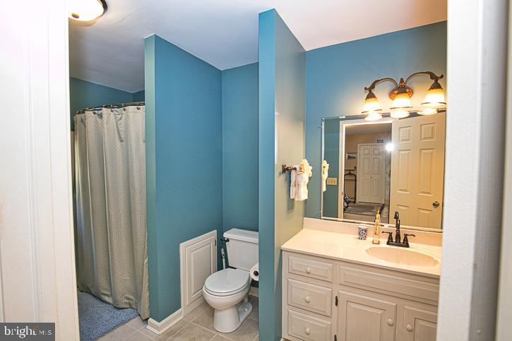 3589 Union Church Road Salisbury, MD 21804 - Photo 51 of 84 a bathroom with a toilet sink double vanity and mirror