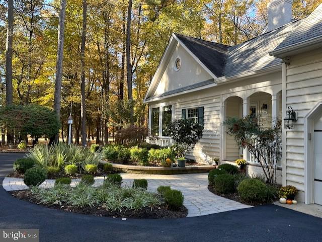 3589 Union Church Road Salisbury, MD 21804 - Photo 65 of 84 a front view of a house with a yard and a garden