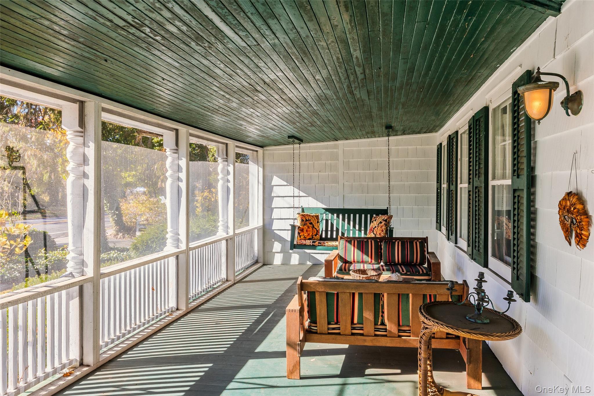 403 Middle Road Bayport, NY 11705 - Photo 4 of 48 a view of balcony with wooden floor and outdoor seating