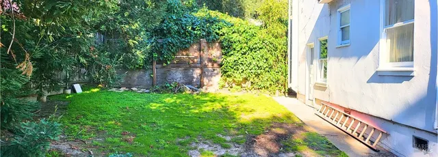 a view of staircase with white walls