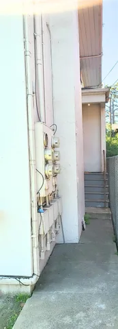 a view of a storage and utility room with washer and dryer