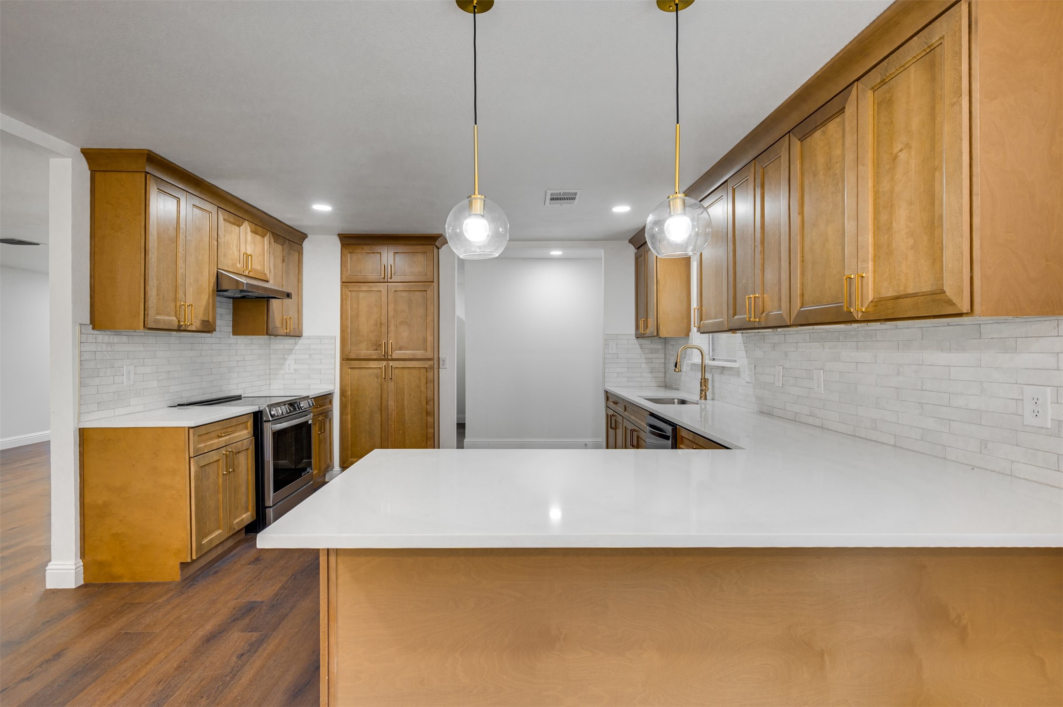 302 An County Road 3914 Palestine, TX 75801 - Photo 11 of 44 a kitchen with stainless steel appliances kitchen island a cabinets and wooden floor